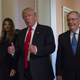Trump, flanked by his wife Melania and Senate Majority Leader Mitch McConnell of Ky., gives a thumbs-up while walking on Capitol Hill in Washington, Thursday, Nov. 10, 2016, after their meeting. Photo via AP